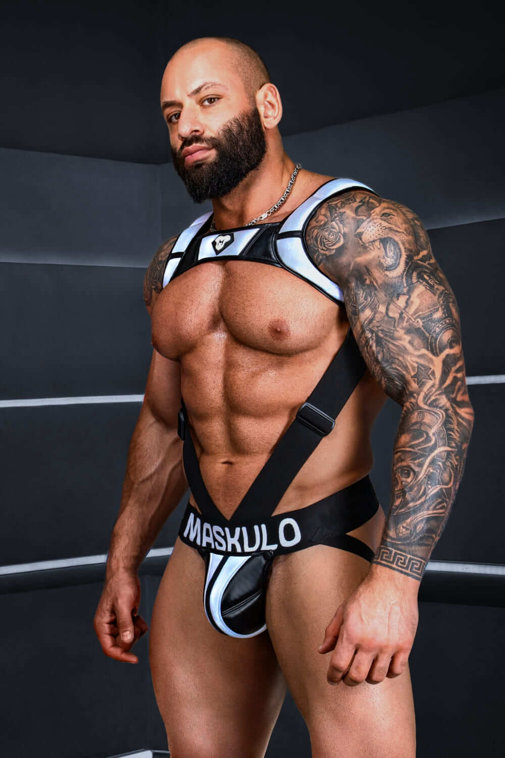 Black and grey "Big Bulge" jockstrap by Maskulo, featuring reflective light elements. Stylish and comfortable performance underwear for men.