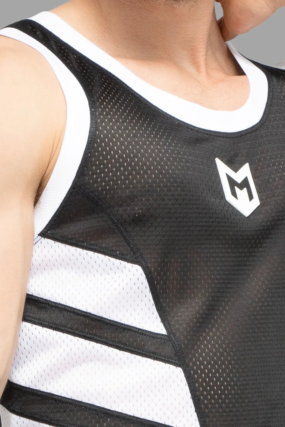 Maskulo Skulla mesh tank top in black and white polyester, soft, breathable, with contrastive side elements and a PVC letter M on the chest.