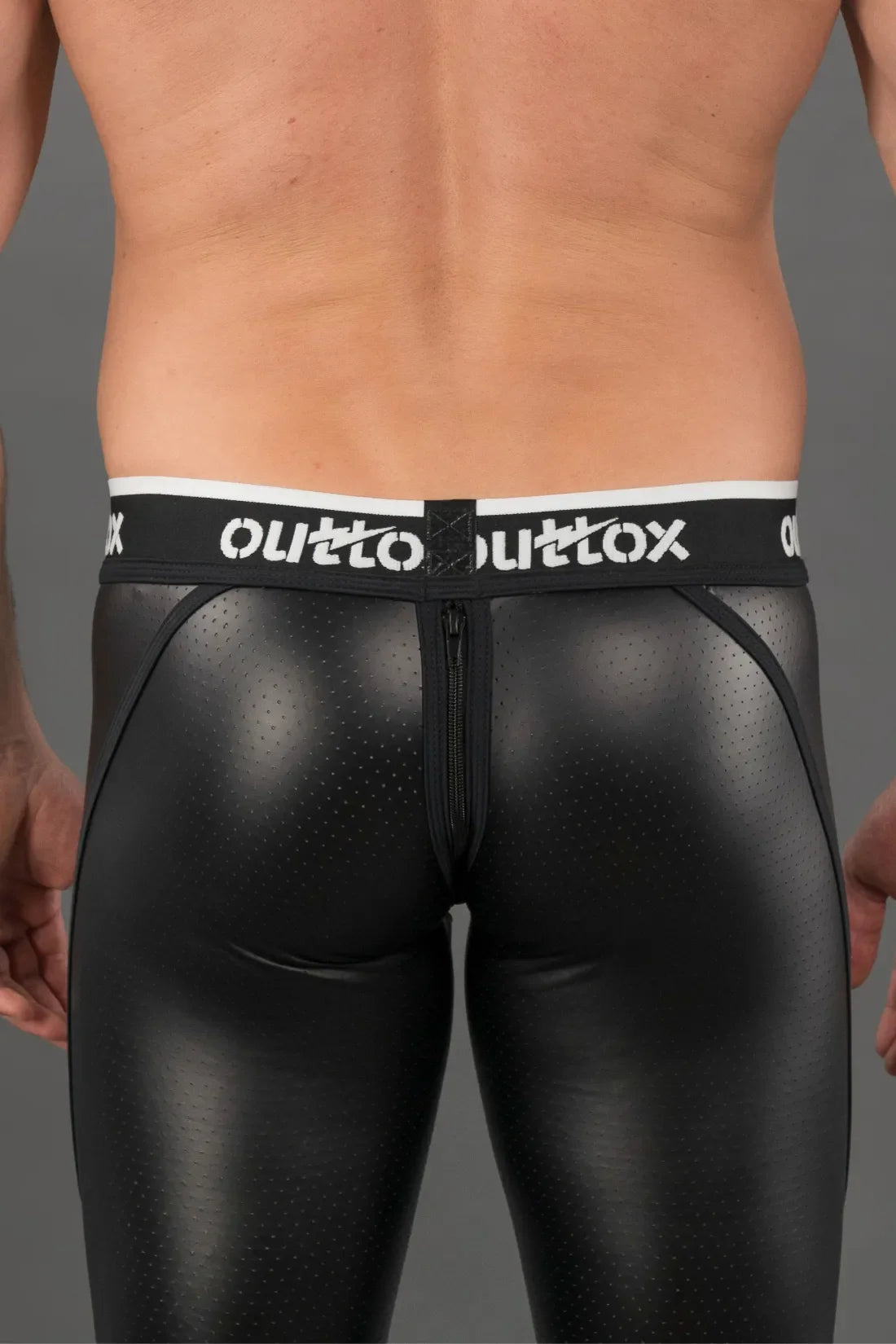 Outtox. Leggings mit Reißverschluss hinten und Druckknopf-Codpiece. Schwarz