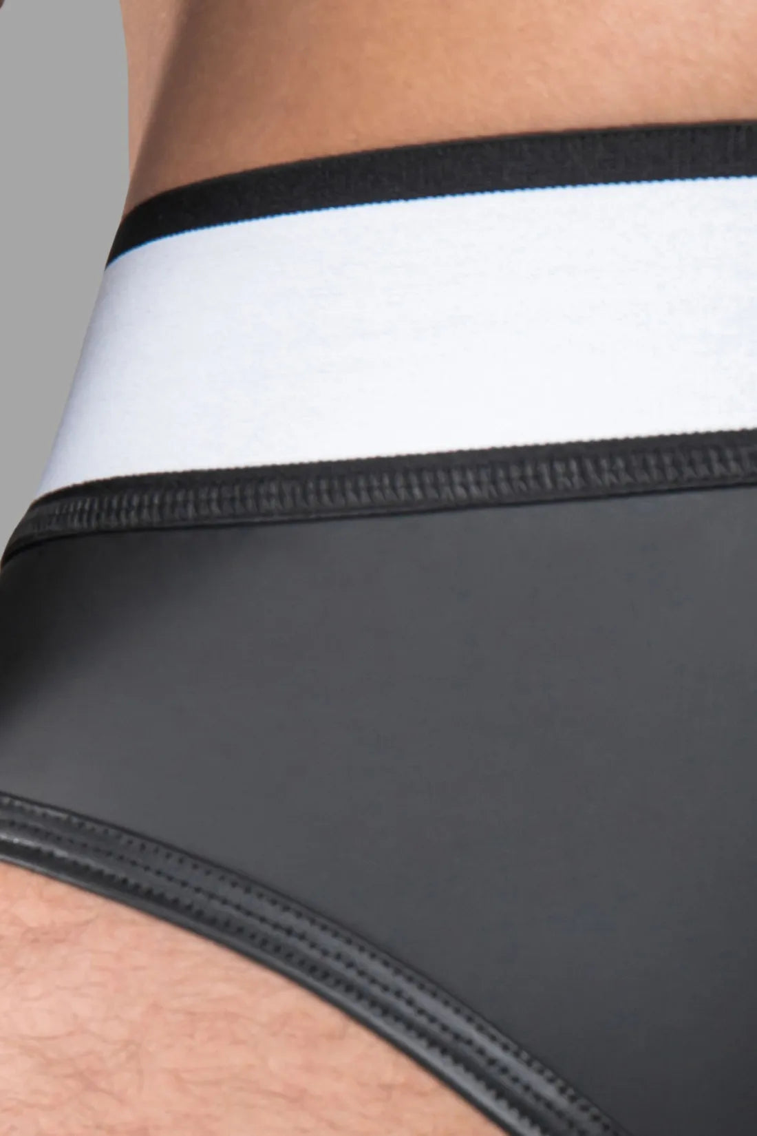 Armored. Rubber look Briefs. Detachable pouch. Zippered rear. Black